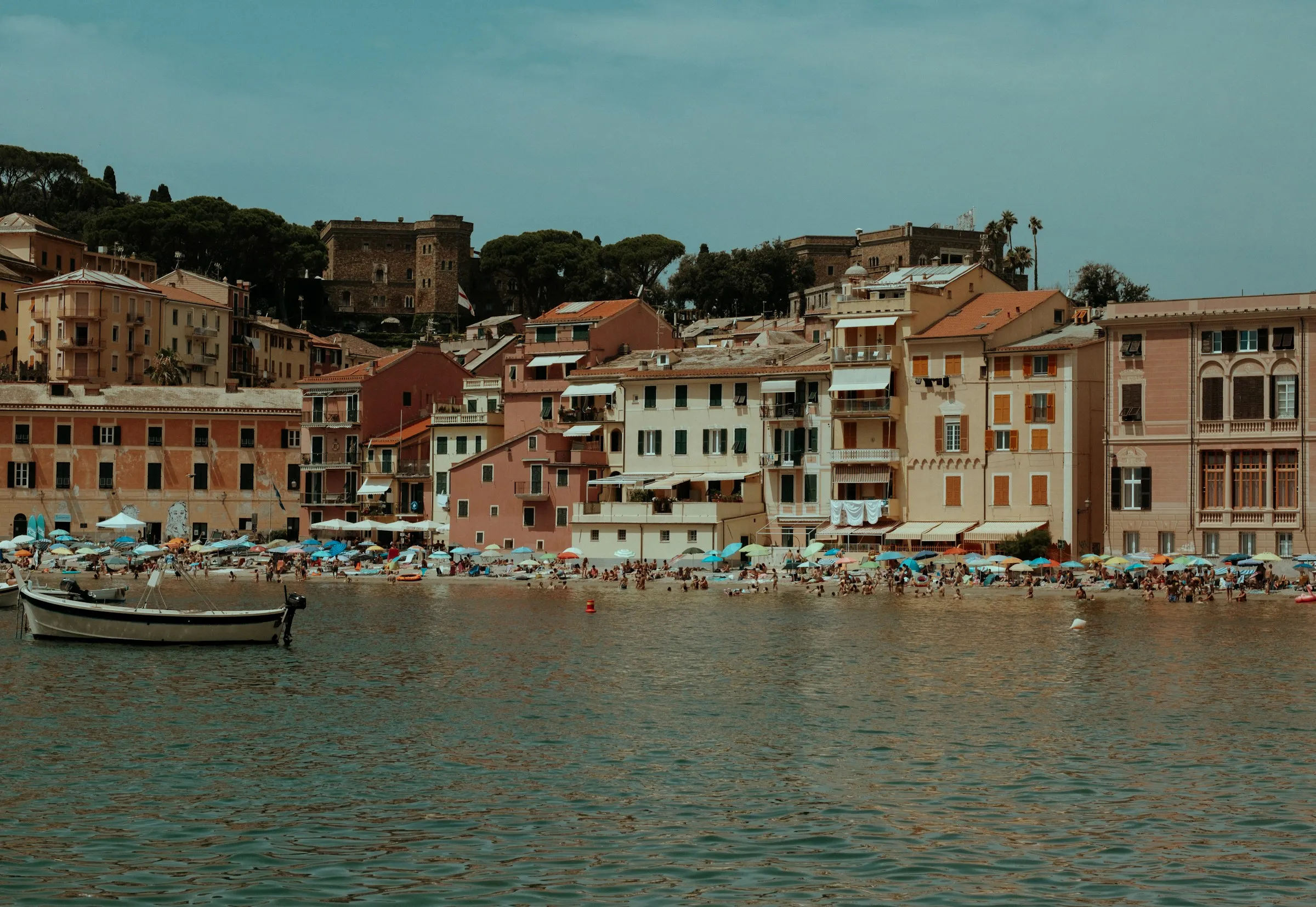 A group of boats floating on top of a body of water